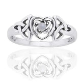 Silver ring with heart and Celtic triquetra trinity knot design with mother of pearl gemstone in centre on a white background